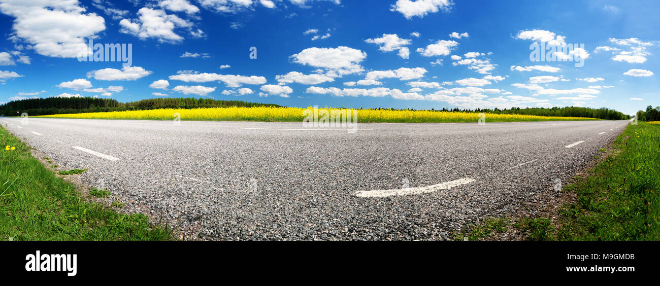 Asphalt road near a field Stock Photo - Alamy