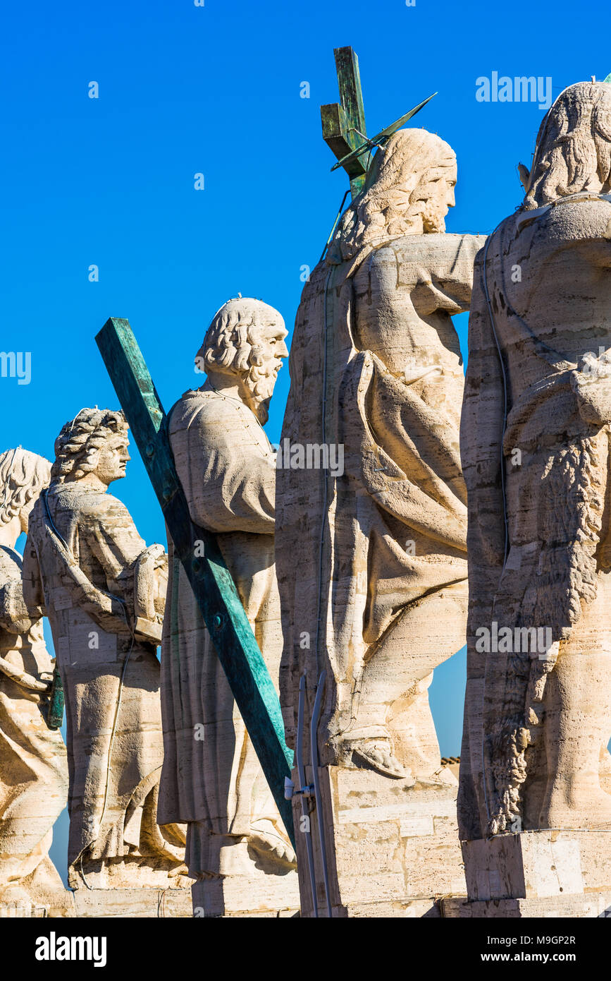 Jesus Christ statue with his 12 disciples at the top of St Peter's
