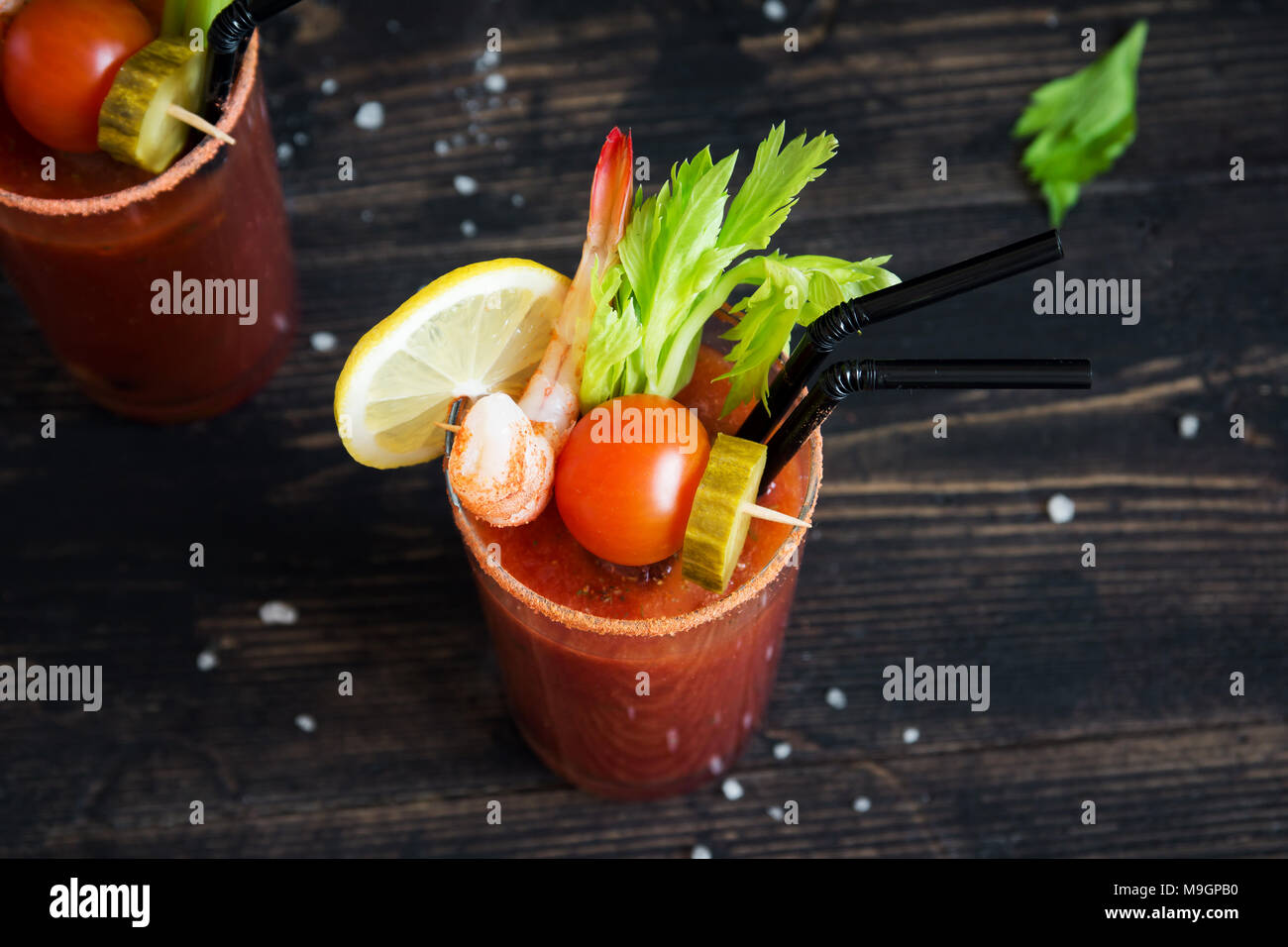 Bloody Mary Cocktail in glass with garnishes. Tomato Bloody Mary spicy