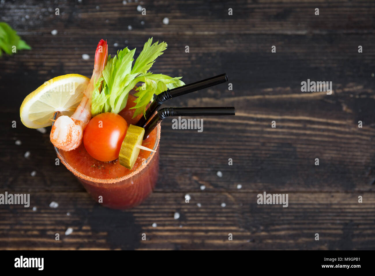 Bloody Mary Cocktail in glass with garnishes. Tomato Bloody Mary spicy
