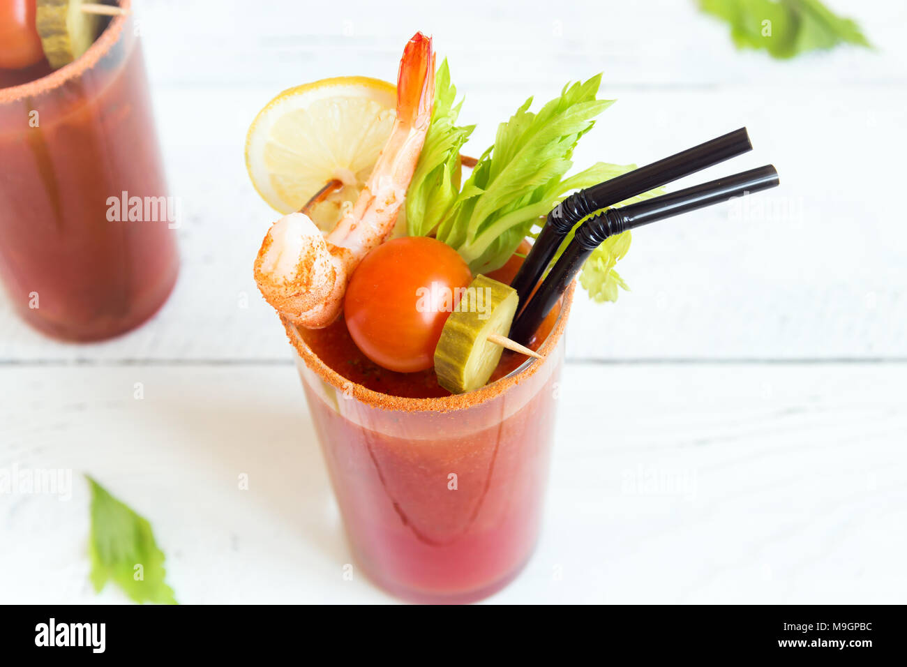 Bloody Mary Cocktail in glass with garnishes. Tomato Bloody Mary spicy