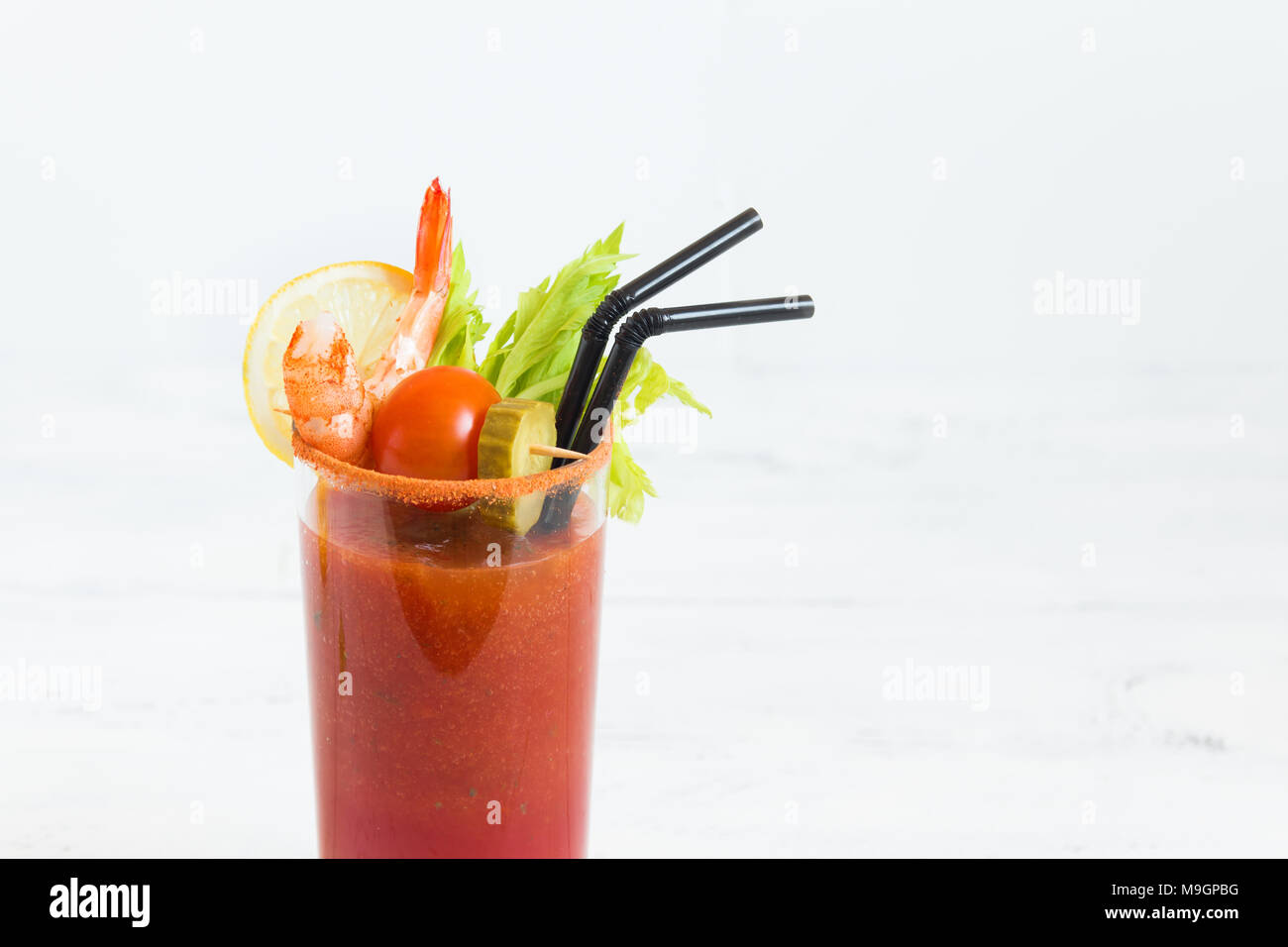 Bloody Mary Cocktail in glass with garnishes. Tomato Bloody Mary spicy