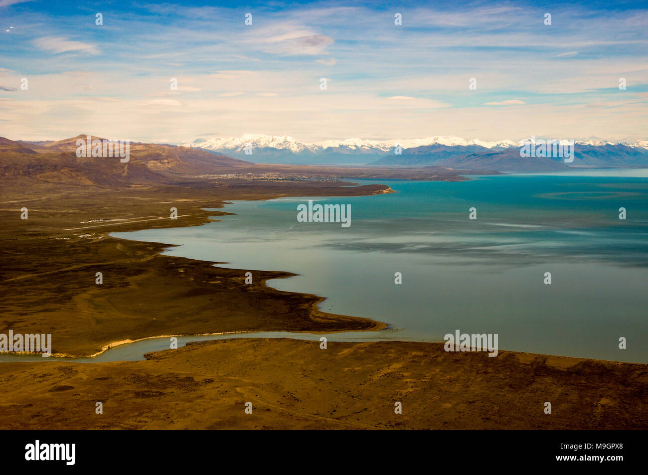 aerial view of El Calafate with its airport at Lago Argentina and the andes in the back, Patagonia, Argentina Stock Photo