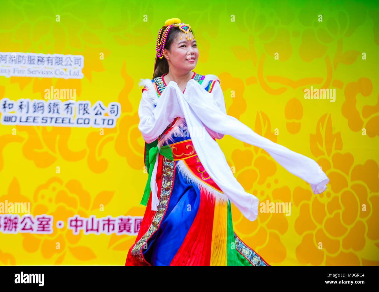 Participant in the 14th Tai Kok Tsui temple fair in Hong Kong Stock