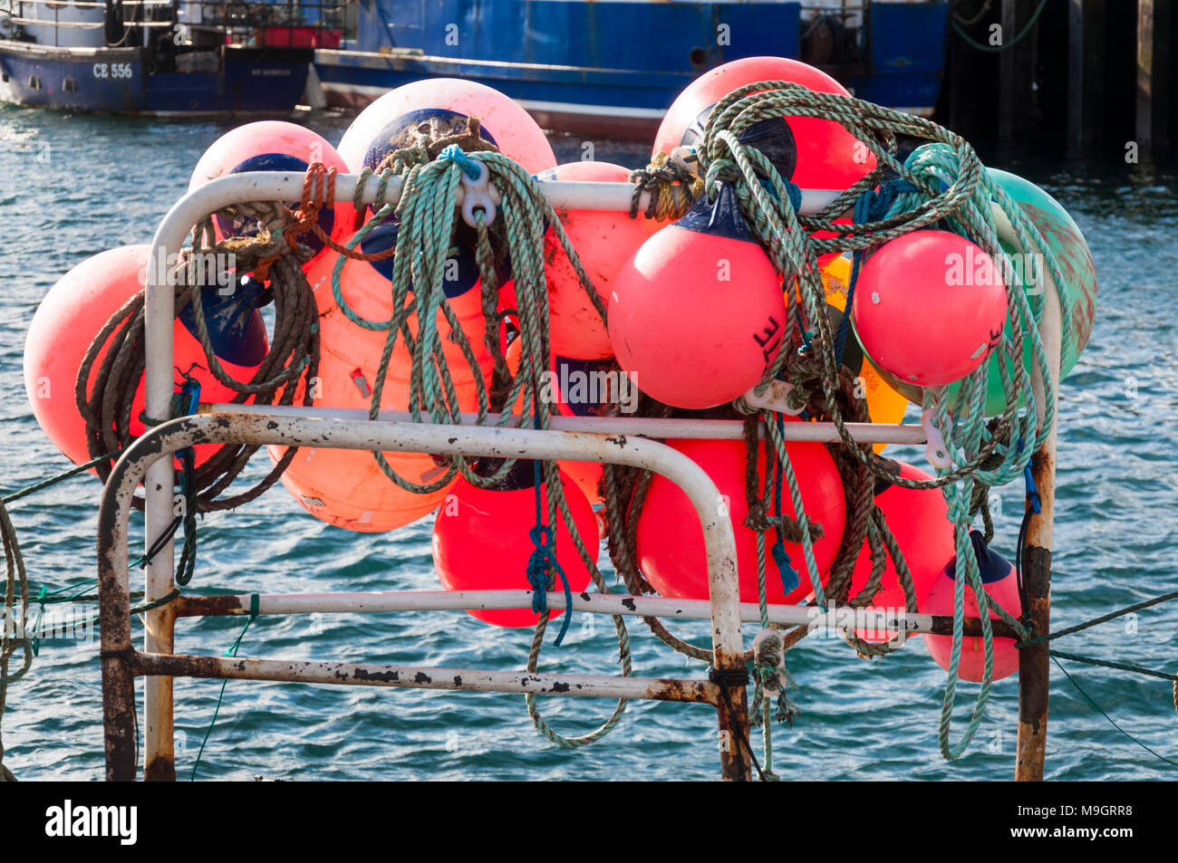 Brightly coloured marker buoys used by shell fishermen to mark location of their crab or lobster pots Stock Photo