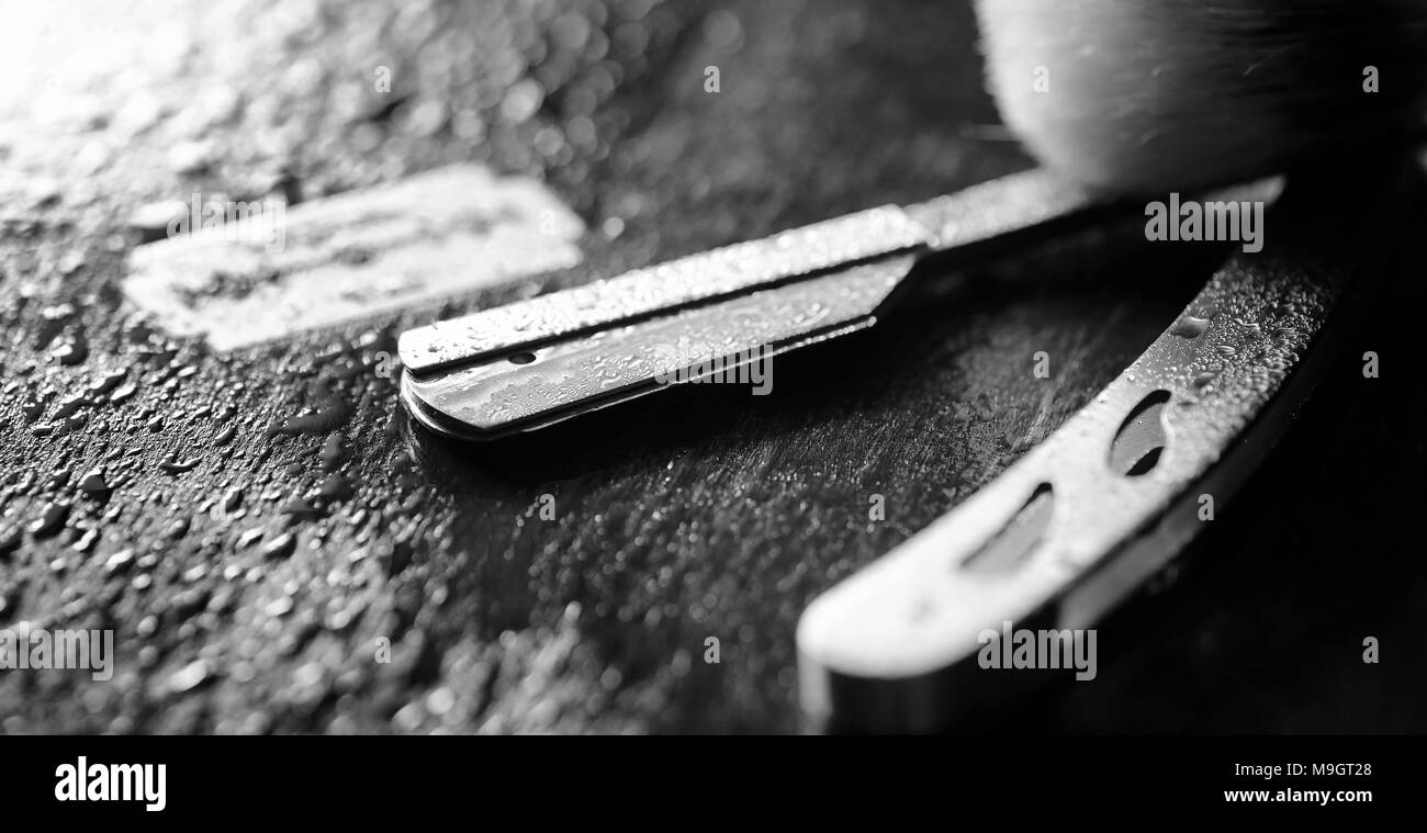 Unsafe Razorblade Shaving razor brush on Black and White Stock Photos & Images - Alamy
