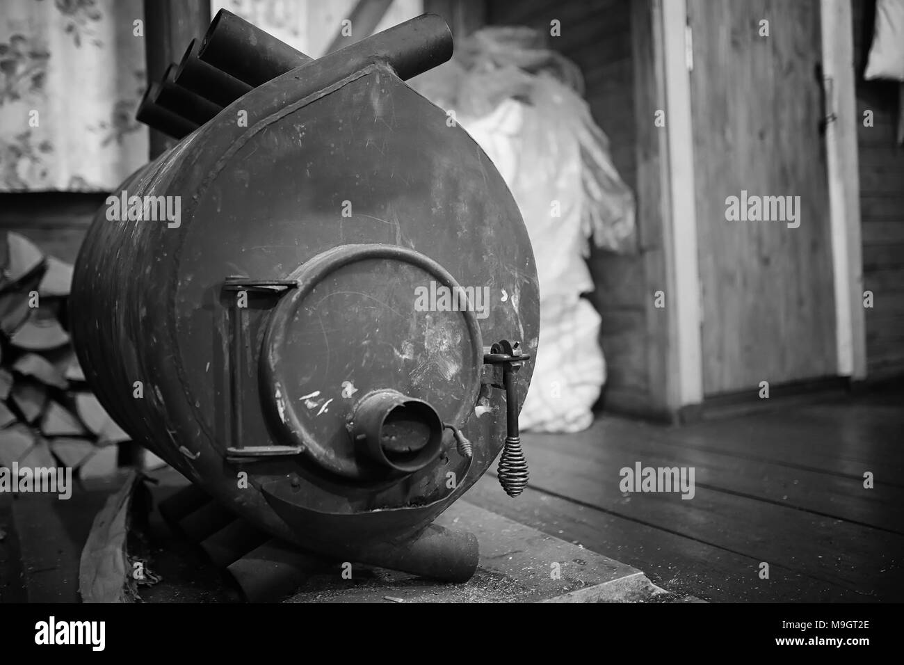 Wood burning stove. Firewood for furnace heating. Warehouse for Stock