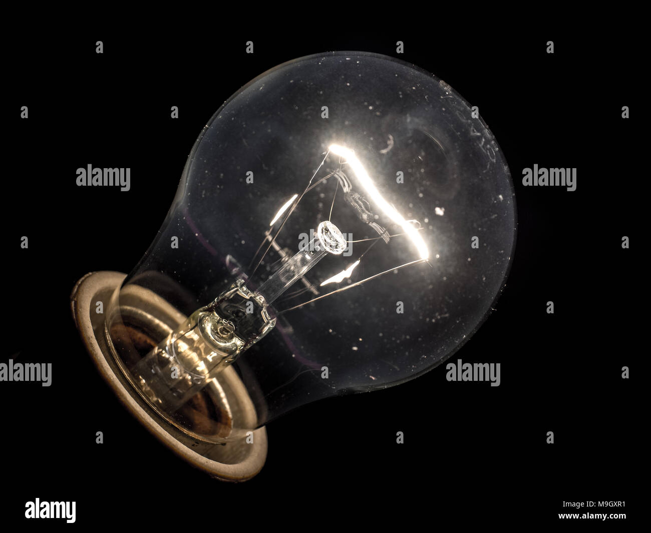 Glowing yellow light bulb, Realistic photo image turn on tungsten light bulb Stock Photo