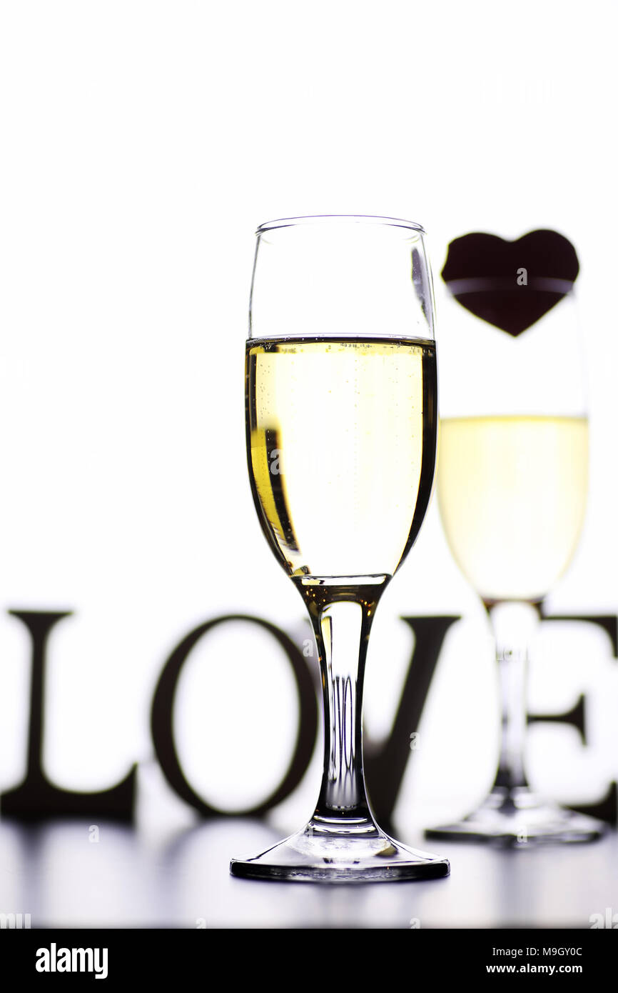 glass of white wine on a table on white background isolate Stock Photo ...