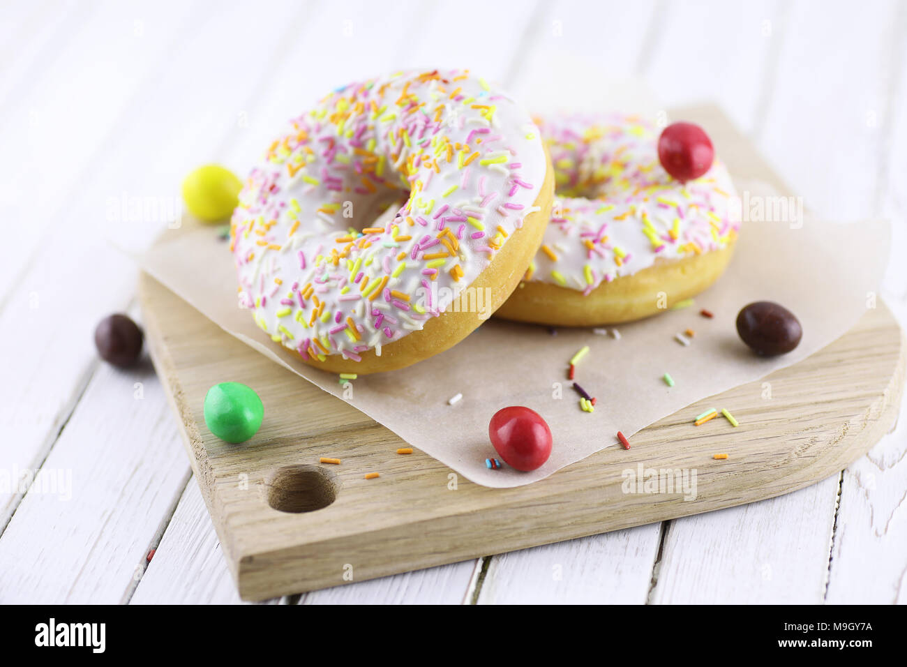 Donut on a wooden white background Stock Photo - Alamy