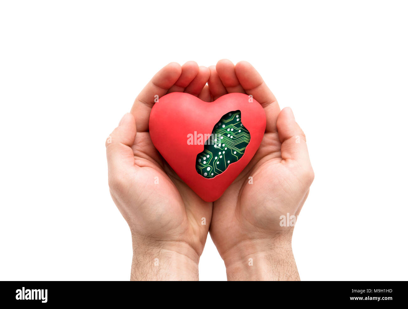 Red computer heart in hands isolated on white with clipping path Stock ...