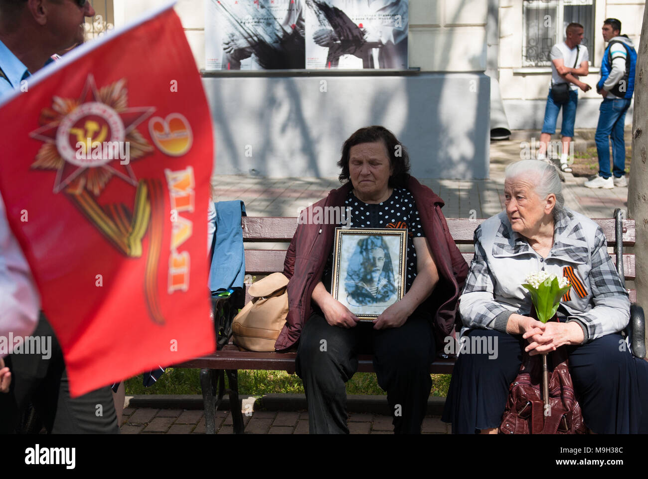 two old women with portrait of their father soldier on victory parade in Sevastopol, May 9, 2017 Stock Photo