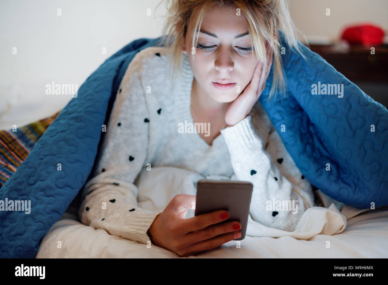 Teenage Girl Victim Of Bullying reading Text Message Stock Photo ...