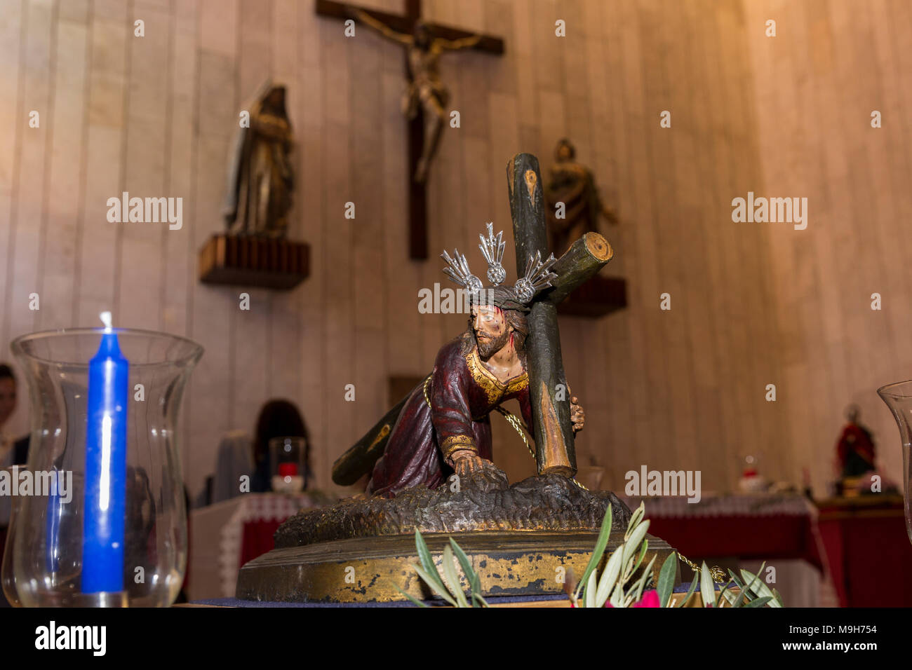 Small statues of Jesus Christ and the Virgin Mary, depicting various