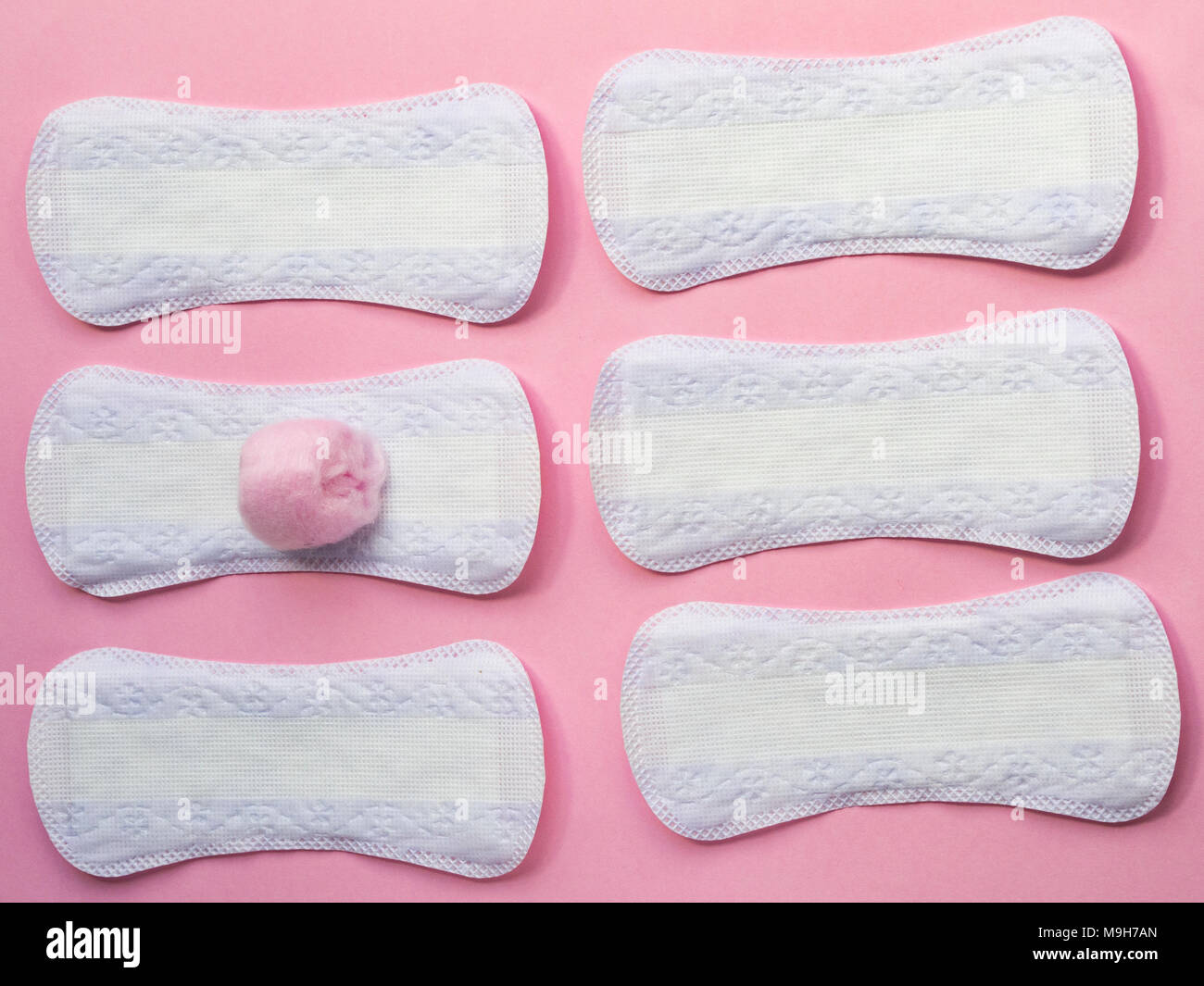 Panty liners on pink background with pink cotton Stock Photo Alamy