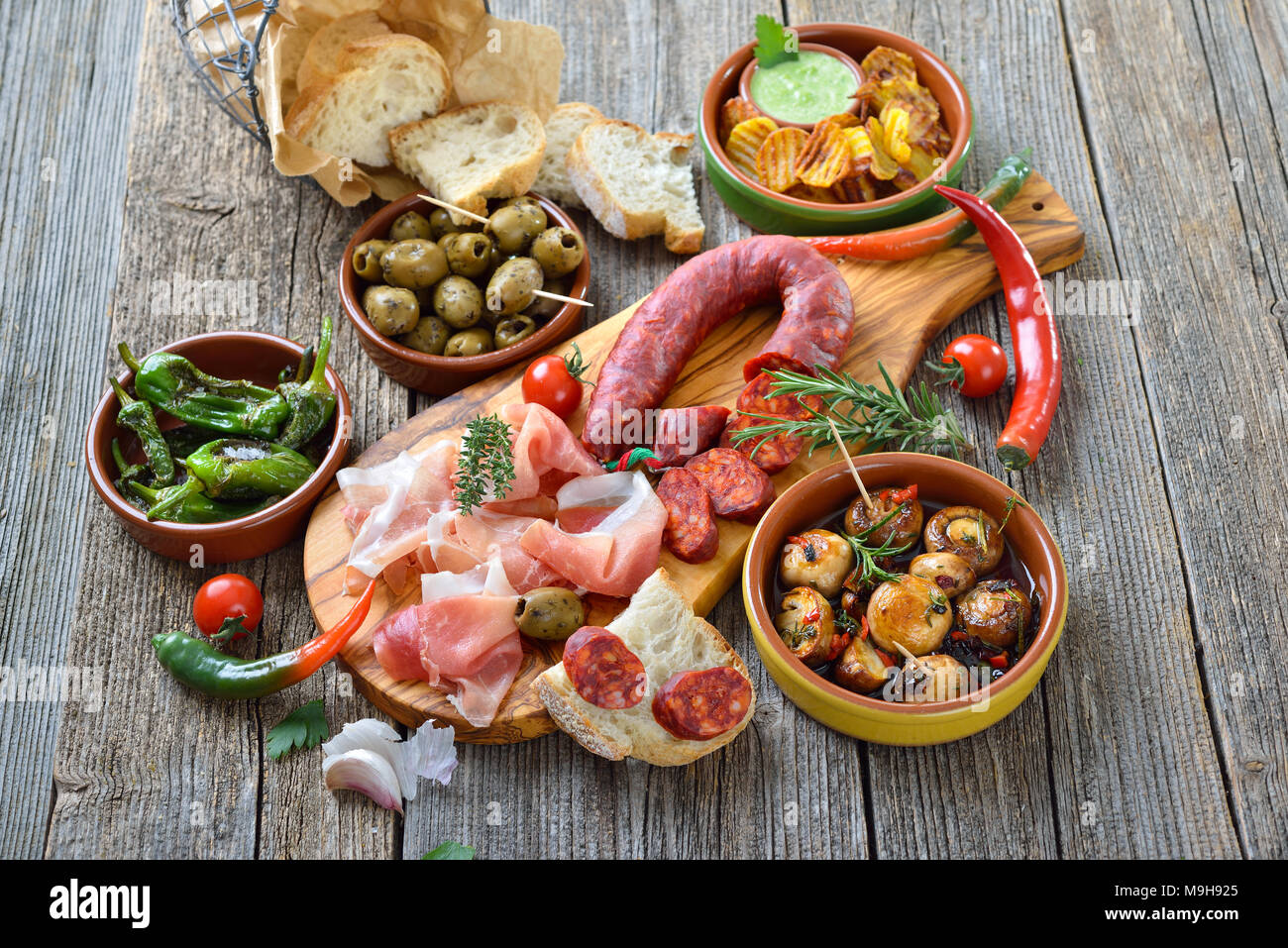 Typical Iberian bar food Spicy chorizo sausage, Serrano ham and other