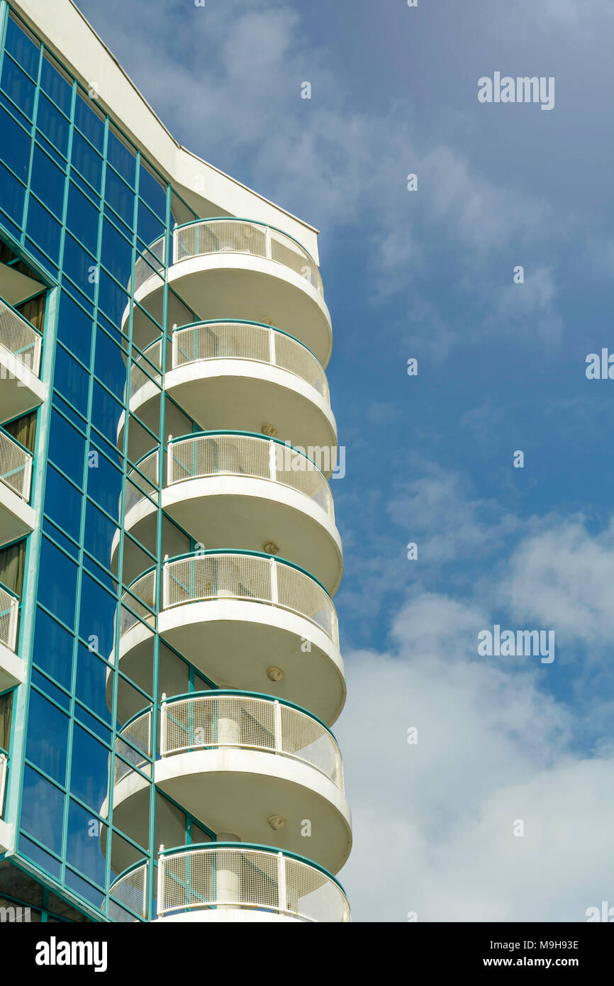 Modern building against vibrant blue sky with clouds Stock Photo - Alamy