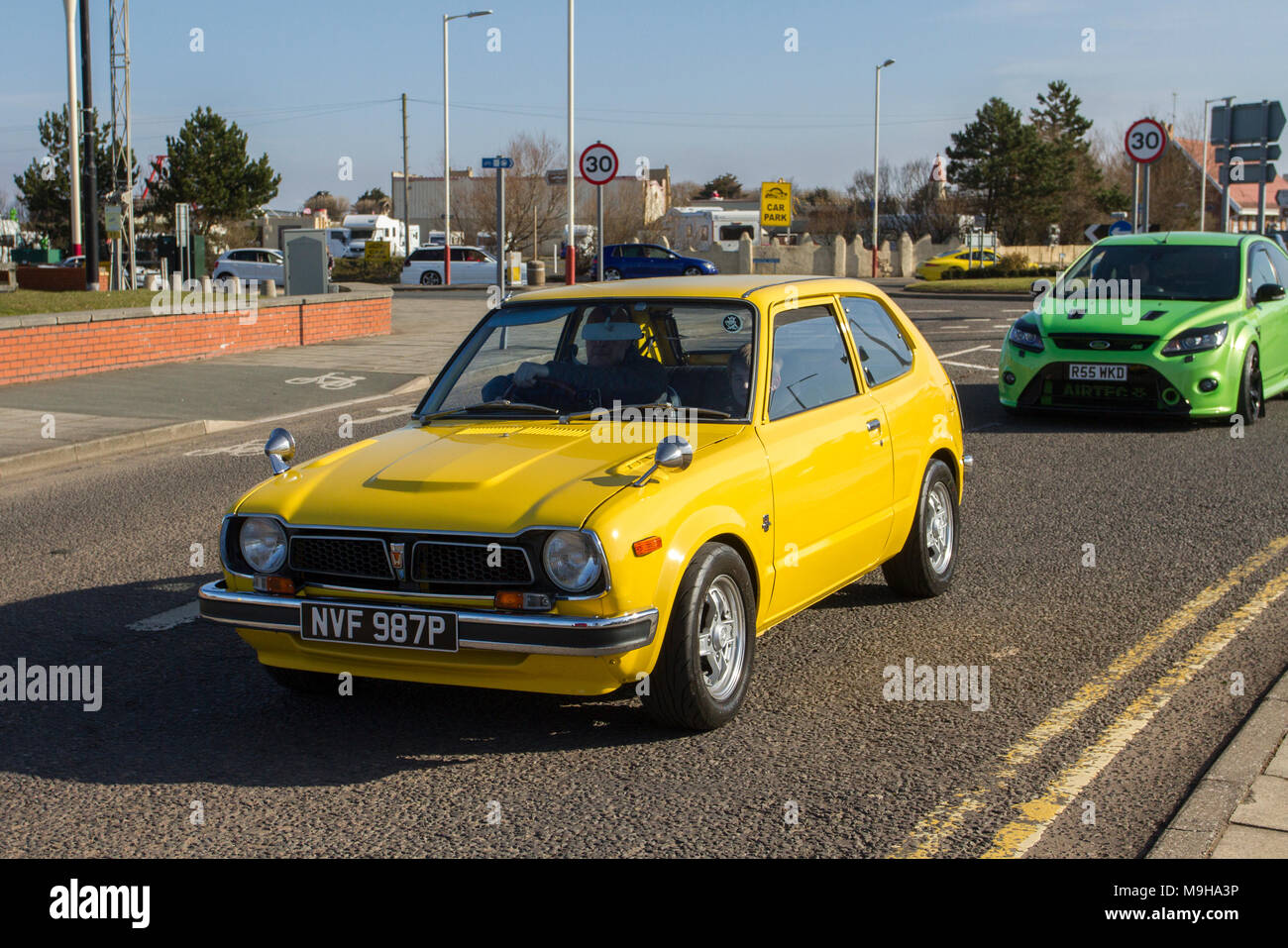 1976 70s yellow Honda Civic 3 Al Auto 1169cc petrol;  North-West Supercar event as cars arrive in the coastal resort of Southport. Classic cars & 70s vintage car enthusiasts enjoy a motoring day out. Stock Photo