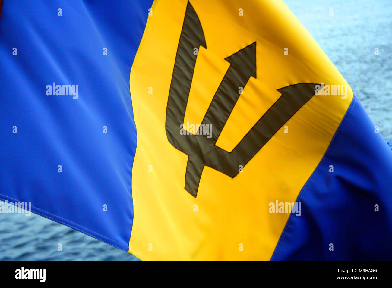 Barbados flag waving by the sea Stock Photo