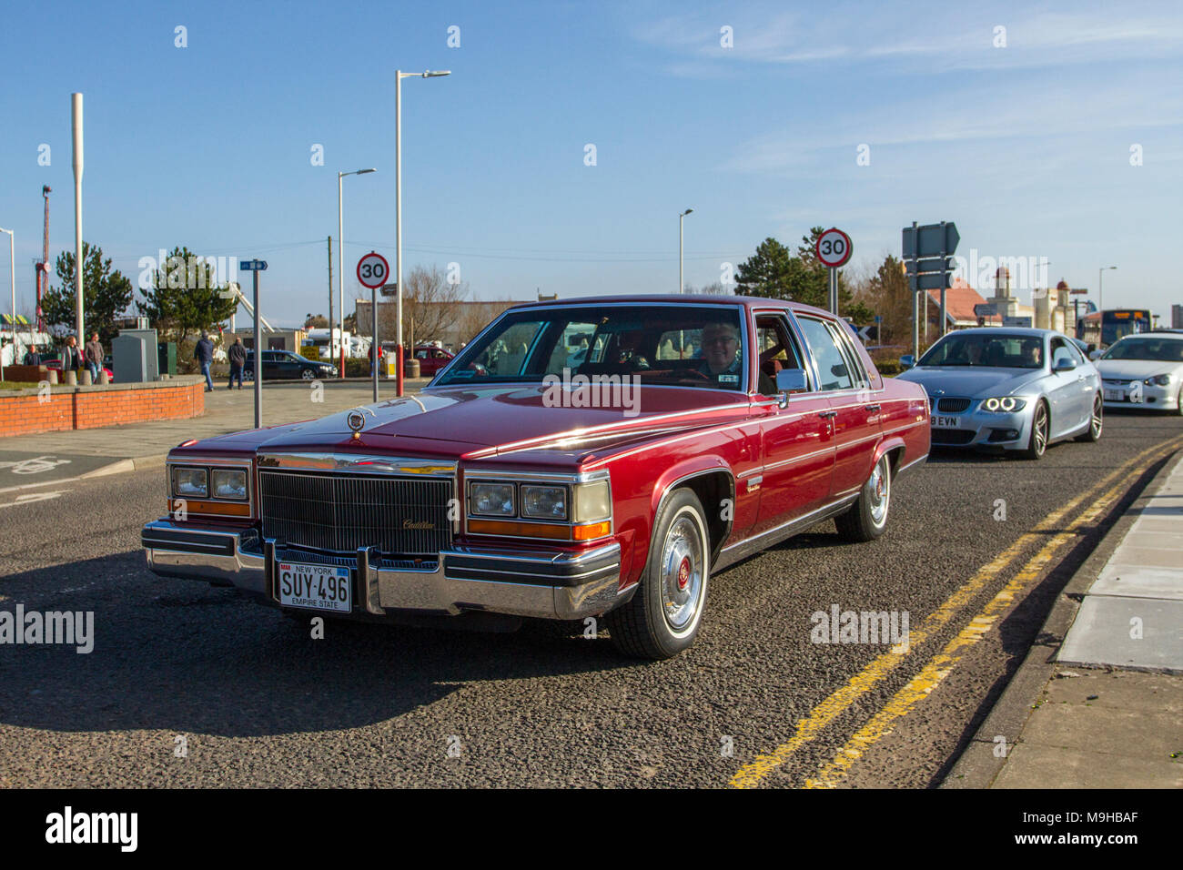 1993 90s  American signature series Cadillac 4100cc saloon at the North-West Supercar event as cars and tourists arrive in the coastal resort of Southport. SuperCars are bumper to bumper on the seafront esplanade as classic & 90s USA car enthusiasts enjoy a motoring day out. Stock Photo