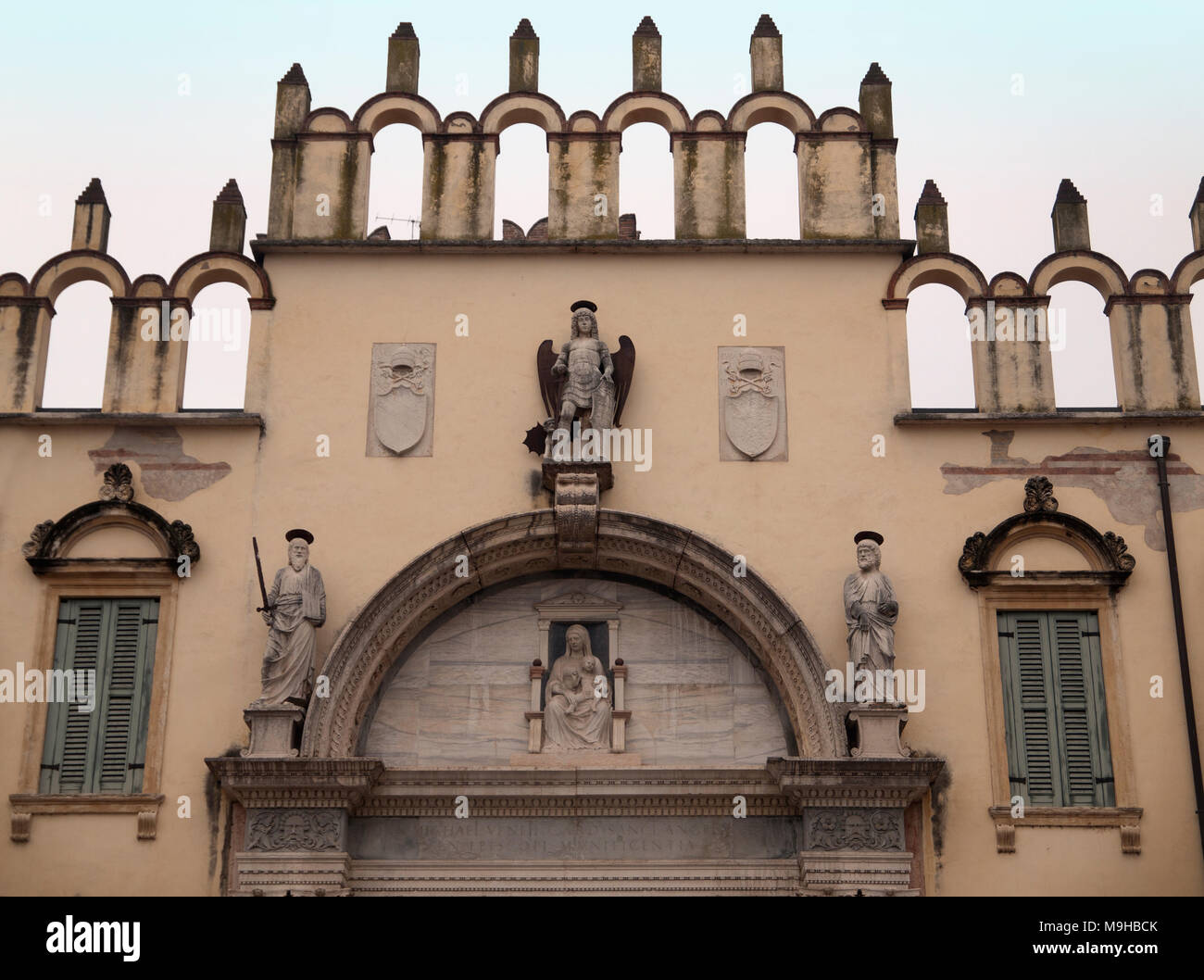 A beautiful and symmetrical ecclesiastical facade in Verona Stock Photo