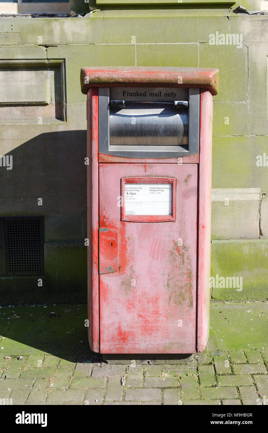 Faded Royal Mail post box for franked mail Stock Photo