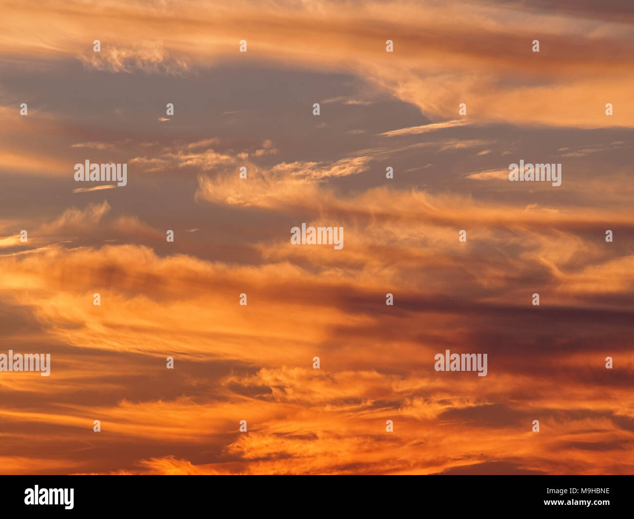 Real cloudy sky at sunset background Stock Photo - Alamy