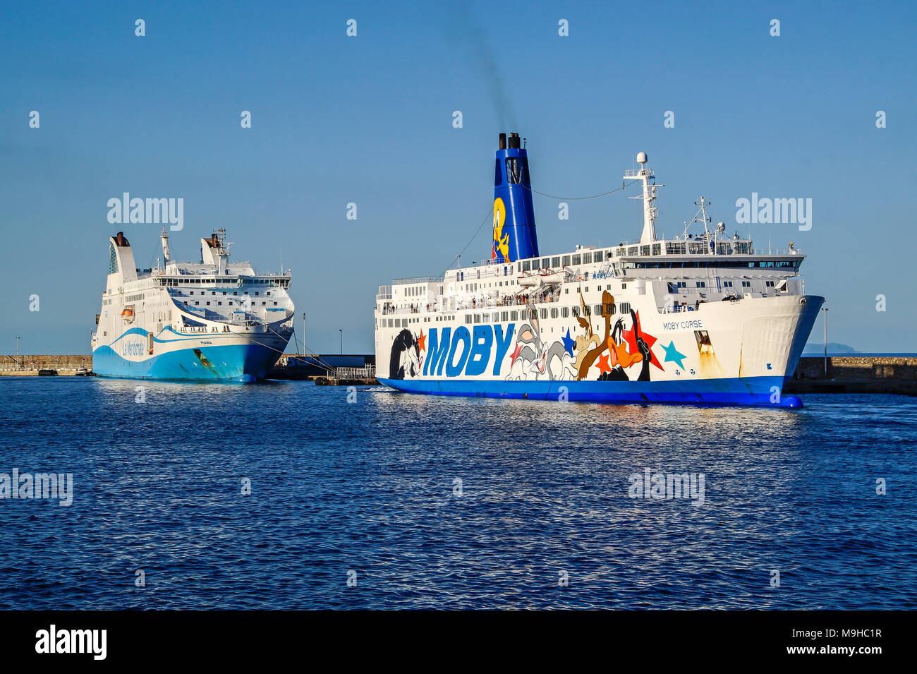 MOBY Ferries MOBY Corse reverses into its berth in the port of Bastia Corsica France Europe with Piana moored left Stock Photo