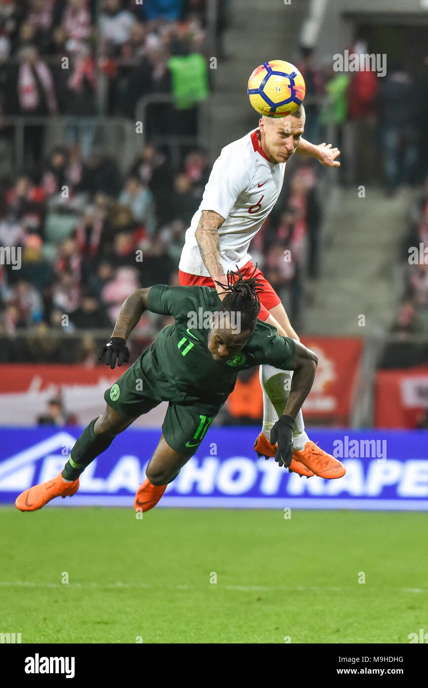 WROCLAW, POLAND - MARCH 23, 2018: Friendly match Poland vs Nigeria 0:1. In action Jacek Goralski (6) and Victor Moses (11). Stock Photo