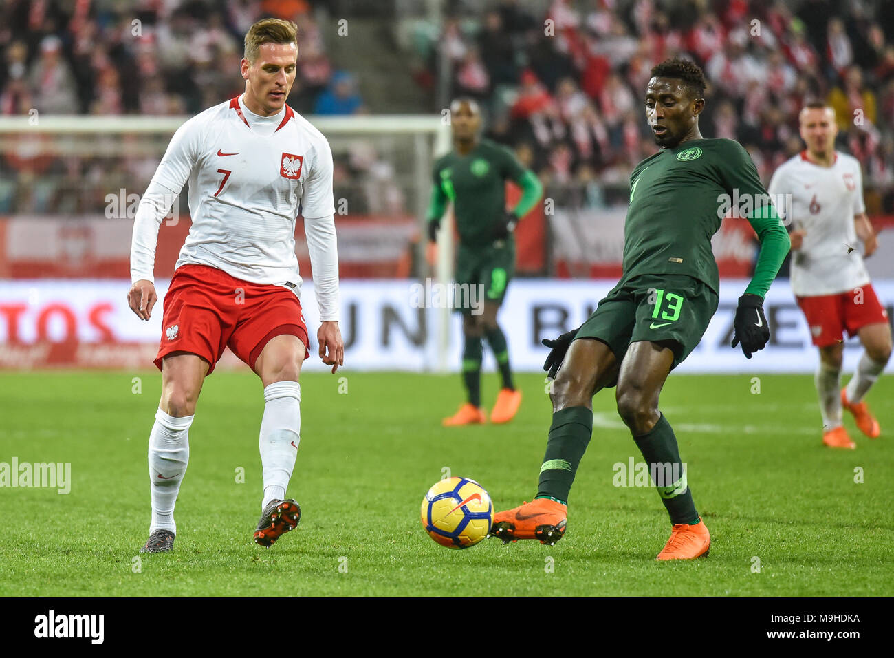 WROCLAW, POLAND - MARCH 23, 2018: Friendly match Poland vs Nigeria 0:1. In action Arkadiusz Milik (L) and Wilfred Ndidi (R). Stock Photo