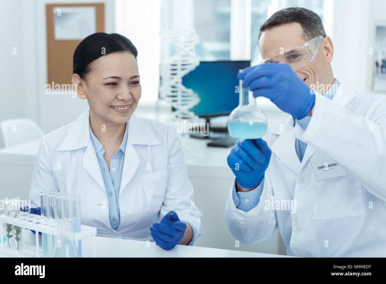 Alert researchers making an experiment in the lab Stock Photo