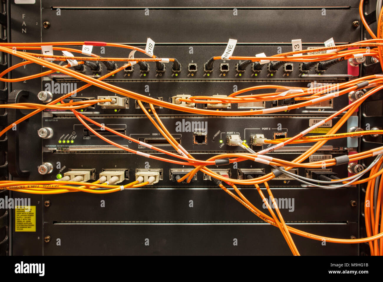 Closeup of CAT 5 cable bundle system in a computer server room Stock