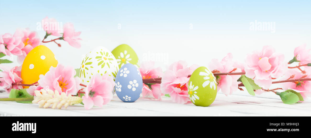 Spring flowers and colorful easter eggs Stock Photo