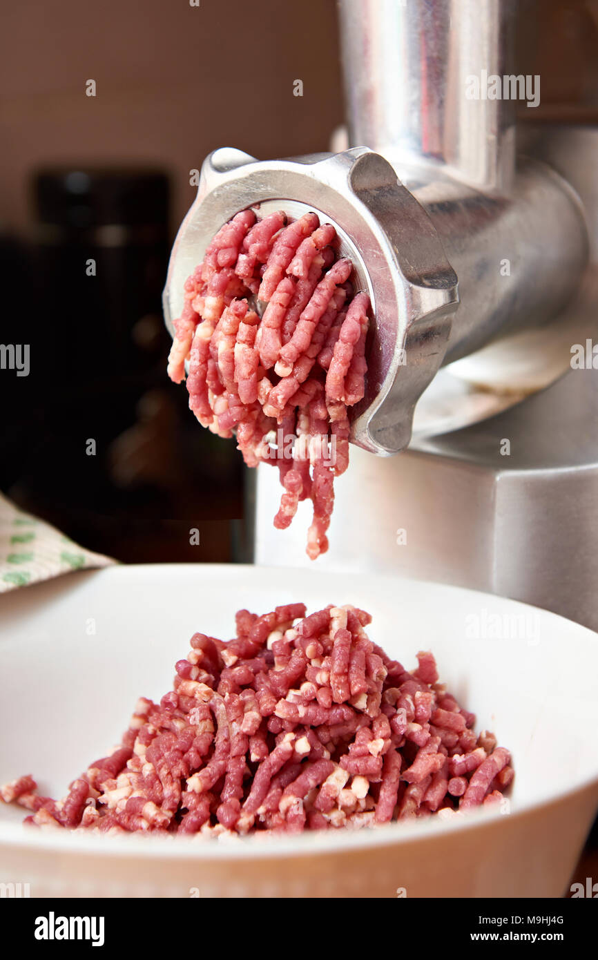 Preparation of minced meat in a meat grinder Stock Photo Alamy