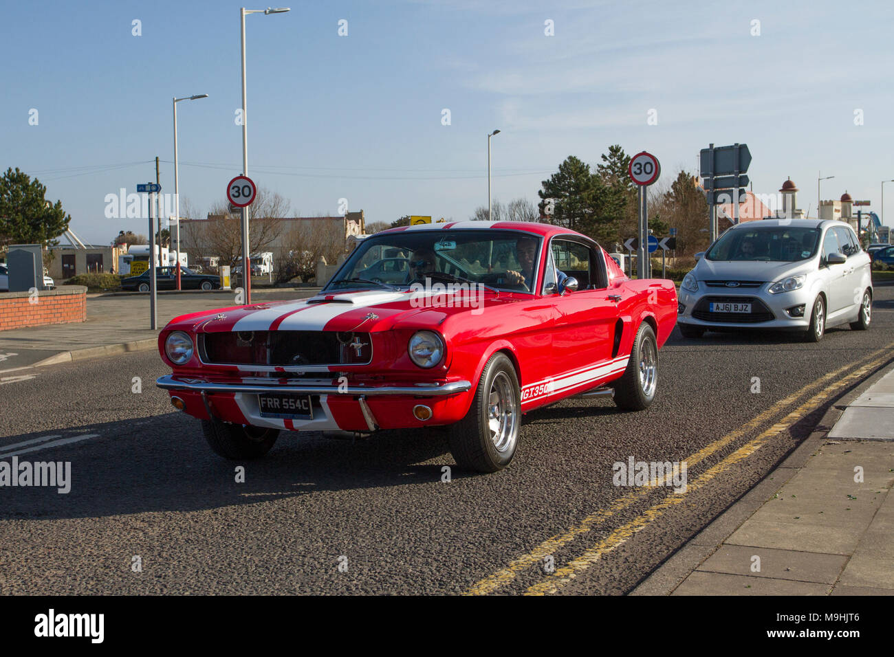 1965 60s Red White Ford Gt Mustang At The North West Supercar Event As Cars And Tourists Arrive In The Coastal Resort Of Southport Supercars Are Bumper To Bumper On The Seafront Esplanade