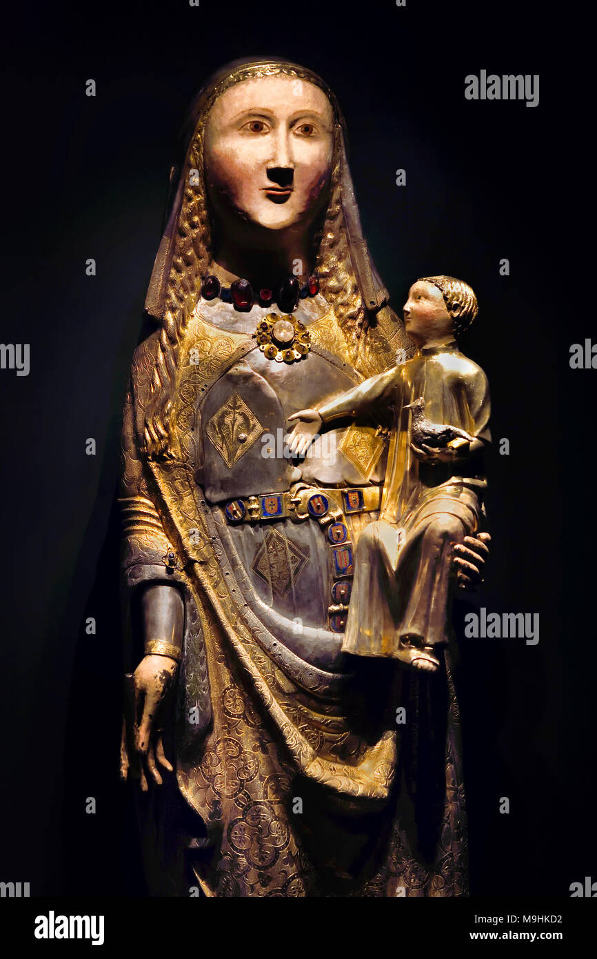 Our Lady and Child medieval metalwork  Reliquary 86.5 x 33 cm 14th century ( Queen Isabel left the  Reliquary to her Coimbra convent )   Portugal, Portuguese ( Isabel of Aragão, Queen of Portugal, founded the first centers for private assistance in the country. Under her initiative, these centers assisted the sick, the old, orphans, the abandoned and prostitutes. ) Stock Photo