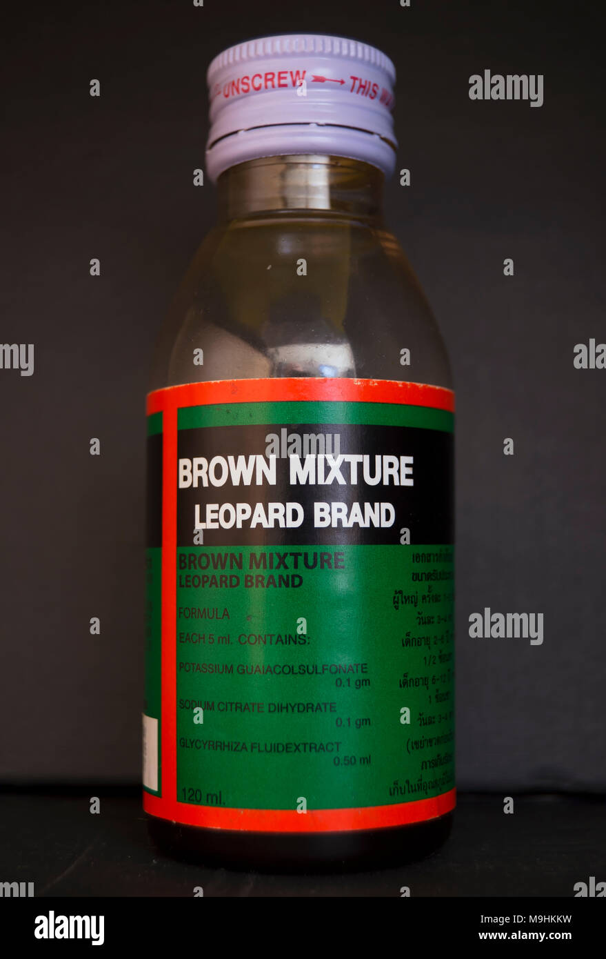 a bottle of brown mixture, an opium derivative thai medicine used to treat coughs Stock Photo