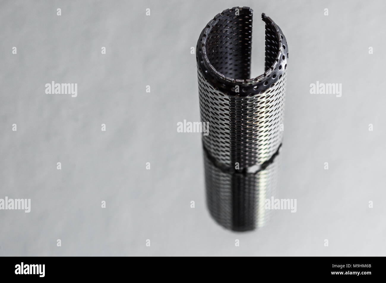 Close up of metallic manufactured object showing fine details Stock Photo