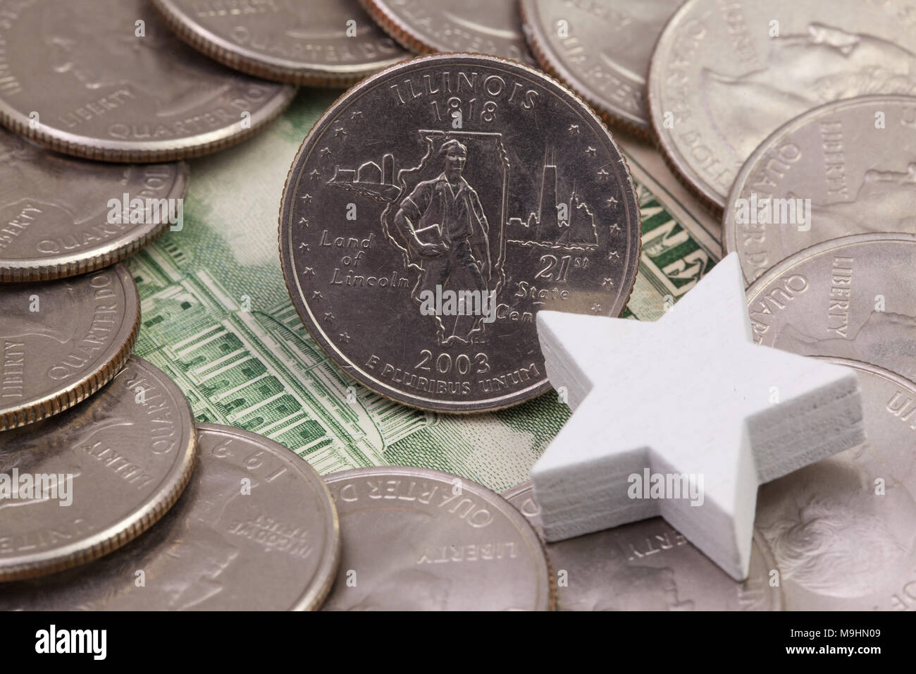 A quarter of Illinois, quarters of USA and white star. A circle of the US quarters with George Washington and in the middle a  quarter of Illinois Sta Stock Photo