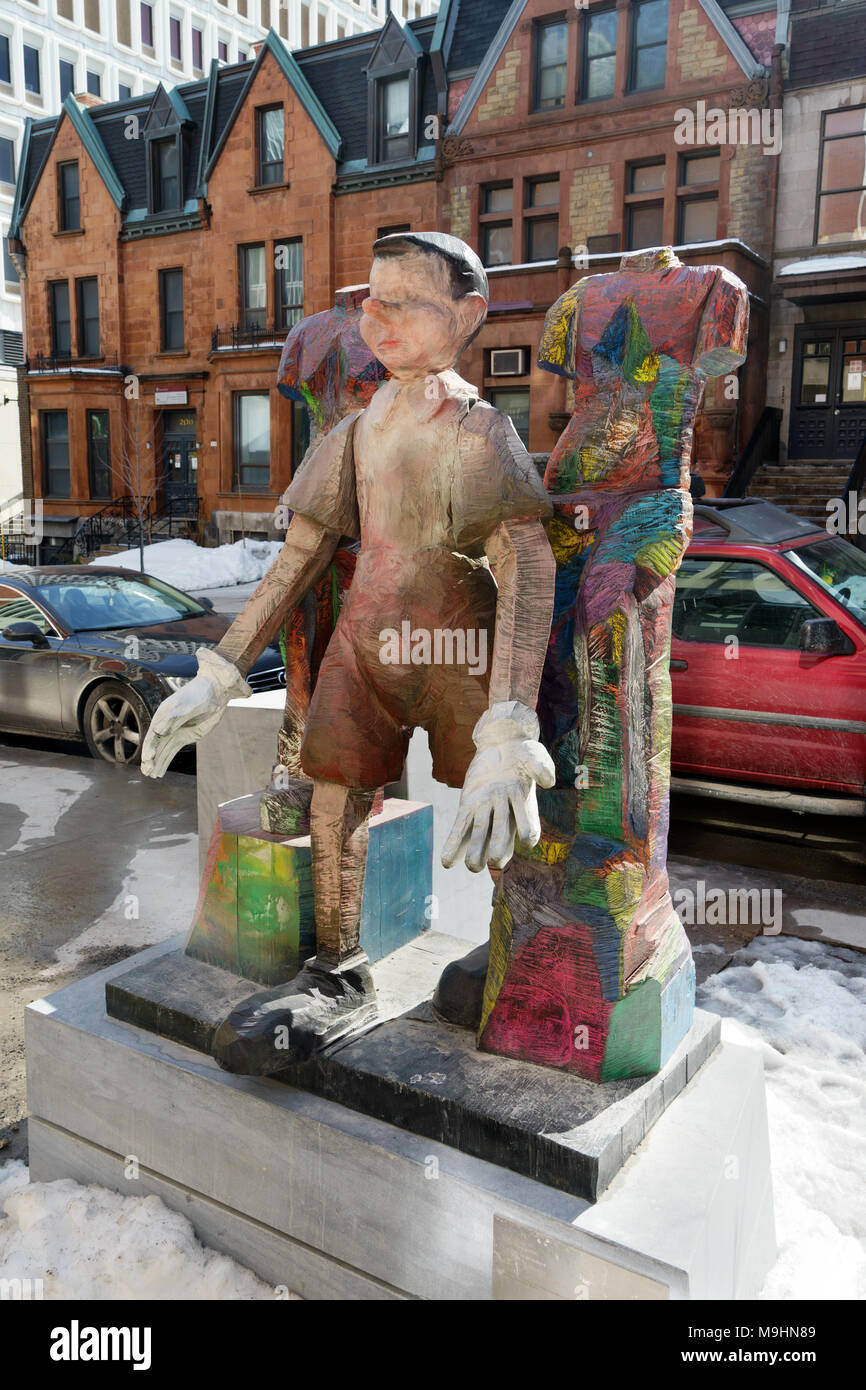 'Brothers and sisters', a bronze sculpture by American pop artist Jim Dine, displayed on Bishop street in downtown Montreal, Canada. Stock Photo