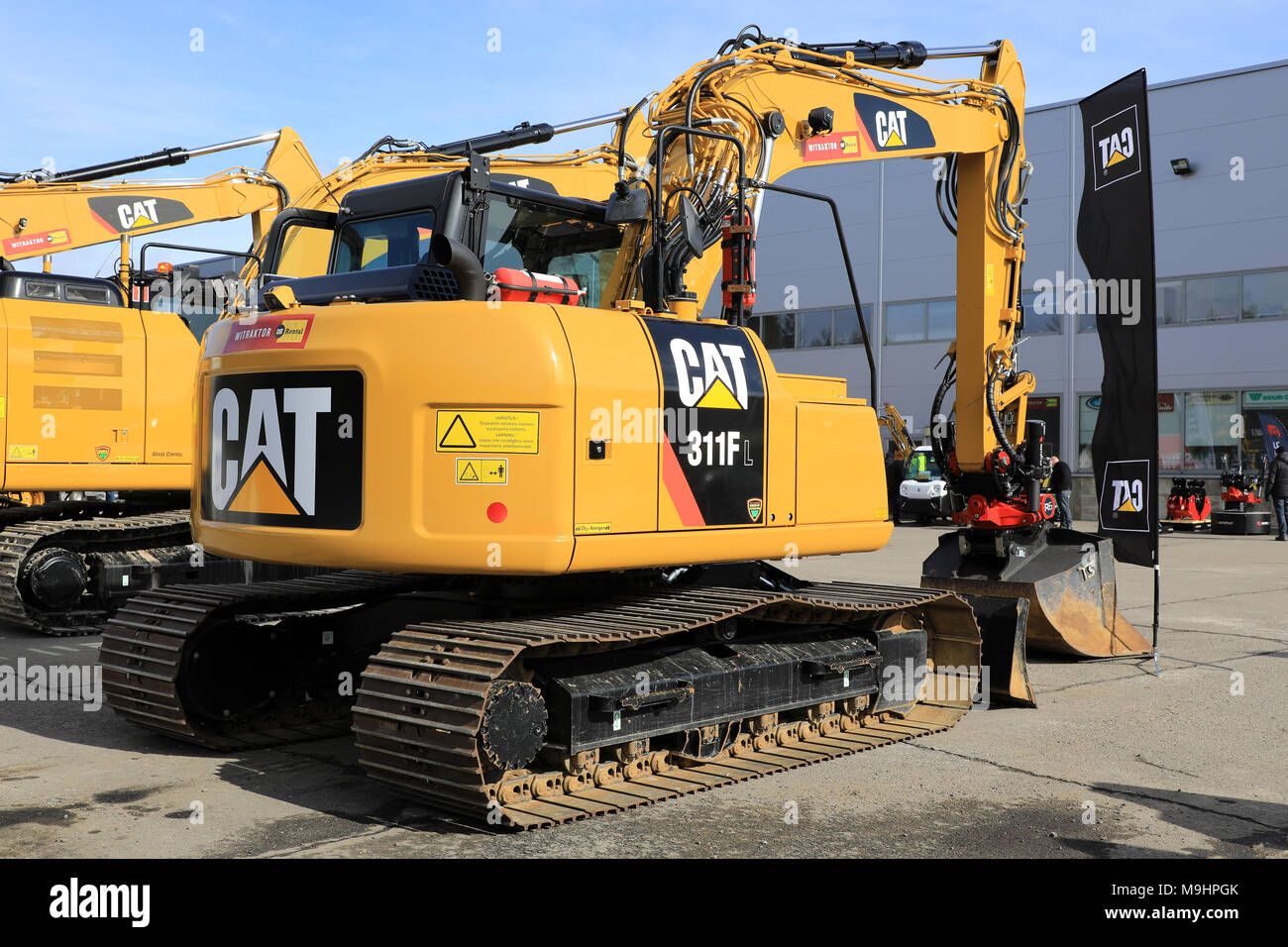 LIETO, FINLAND - MARCH 24, 2018: Cat 311FL Hydraulic excavator and other Cat construction equipment seen at the annual public event of Konekaupan Vill Stock Photo