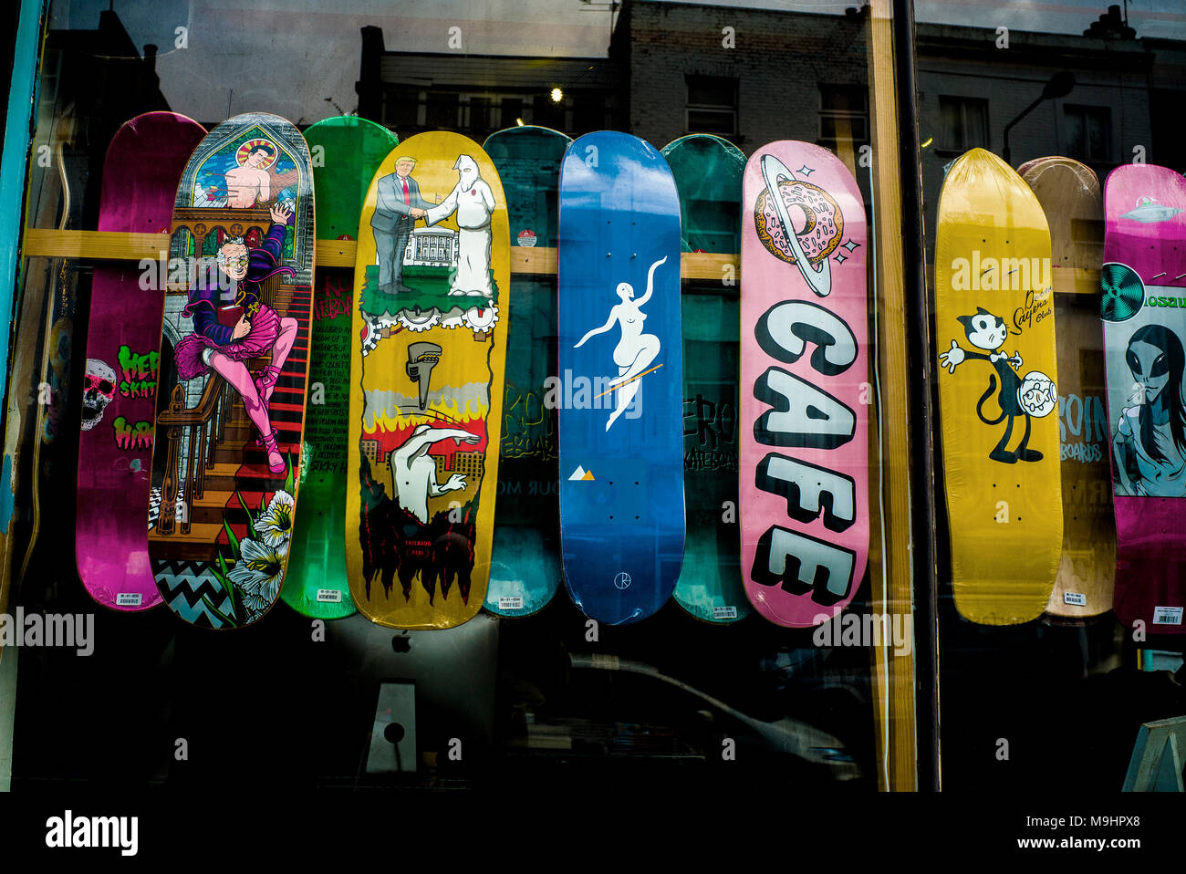 skateboard design, showing, President Donald Trump shaking hands with the KKK, ku klux klan, Stock Photo