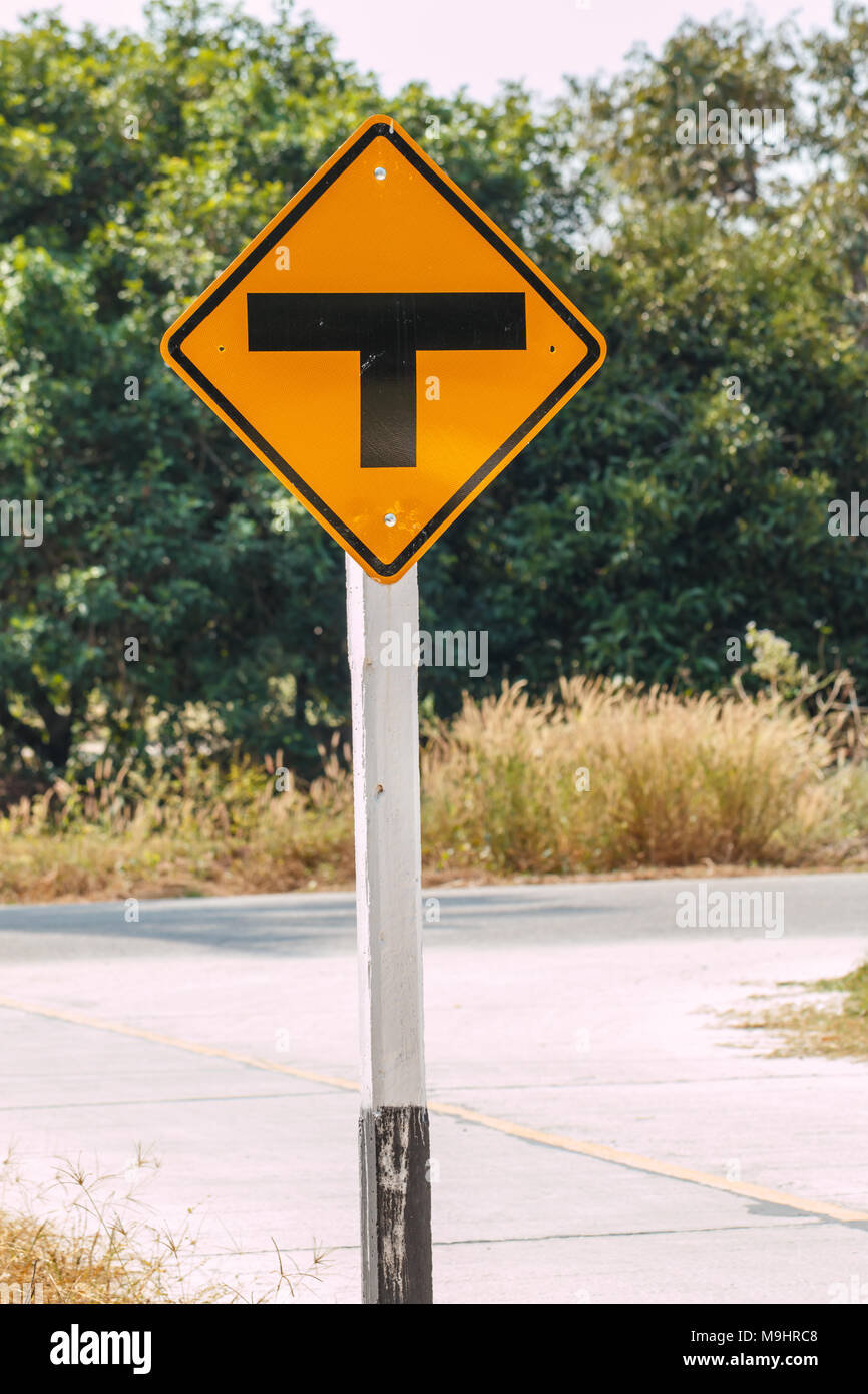 T junction road traffic sign at countryside in Thailand Stock Photo - Alamy