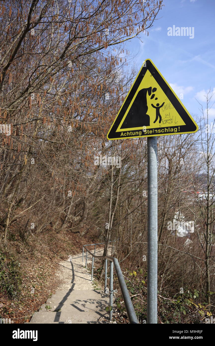 Achtung Steinschlag, yellow german warning sign, hiking path, Black Forest, keep of the rocks Stock Photo