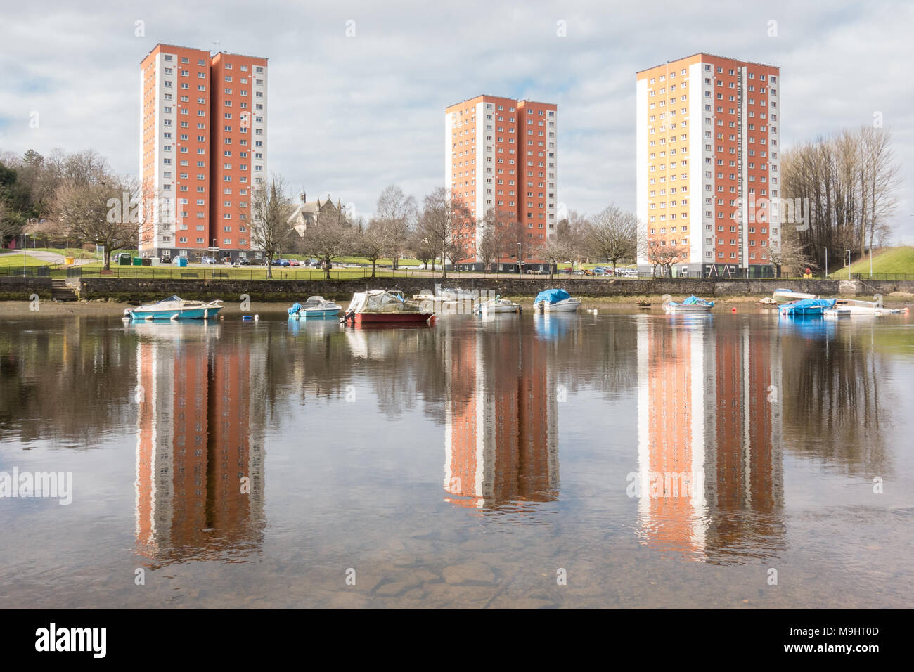 High Rise flats reflected in the River Leven, West Bridgend, Dumbarton, Scotland, UK Stock Photo