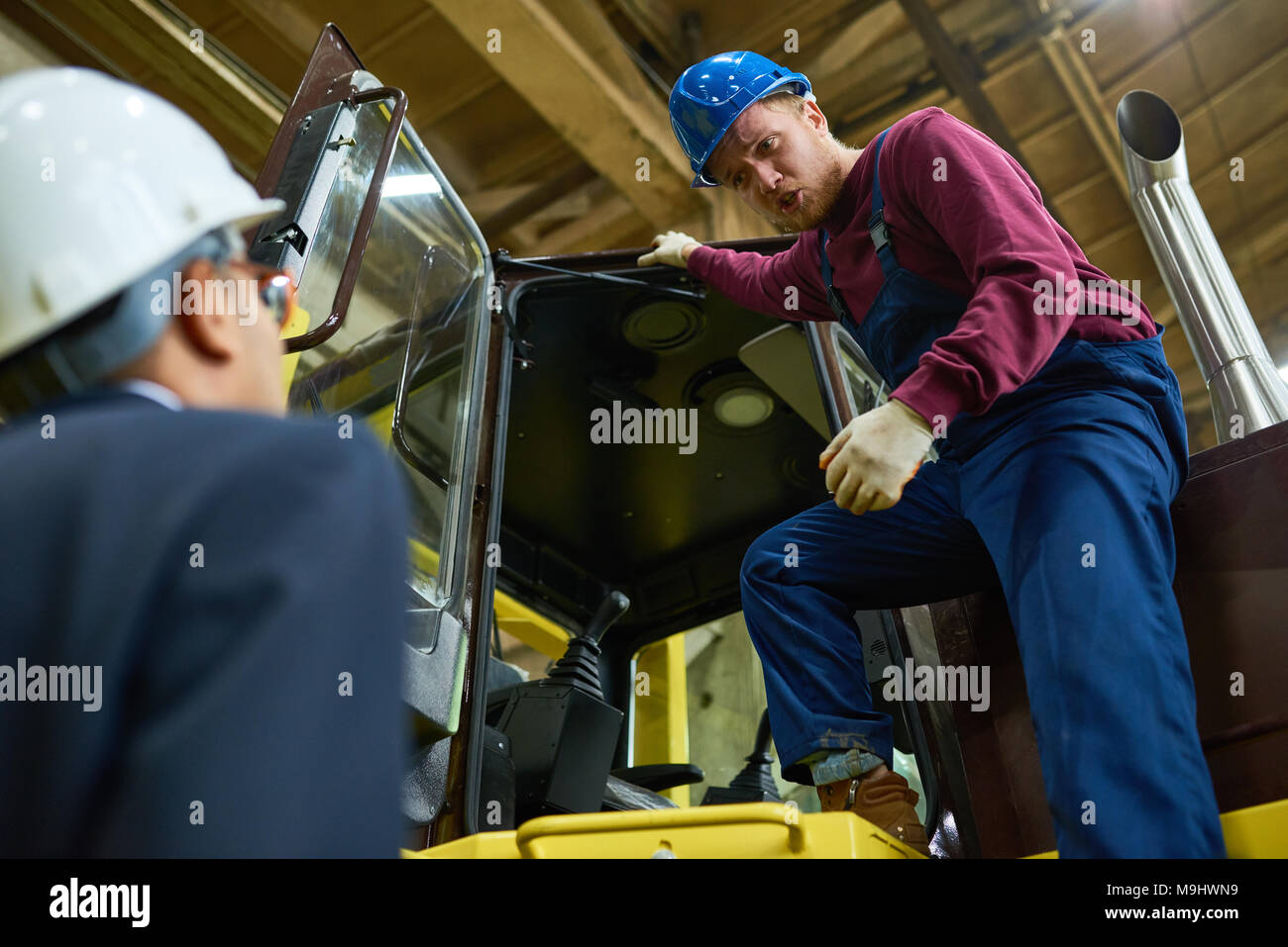 Tractor Driver at Plant Stock Photo Alamy