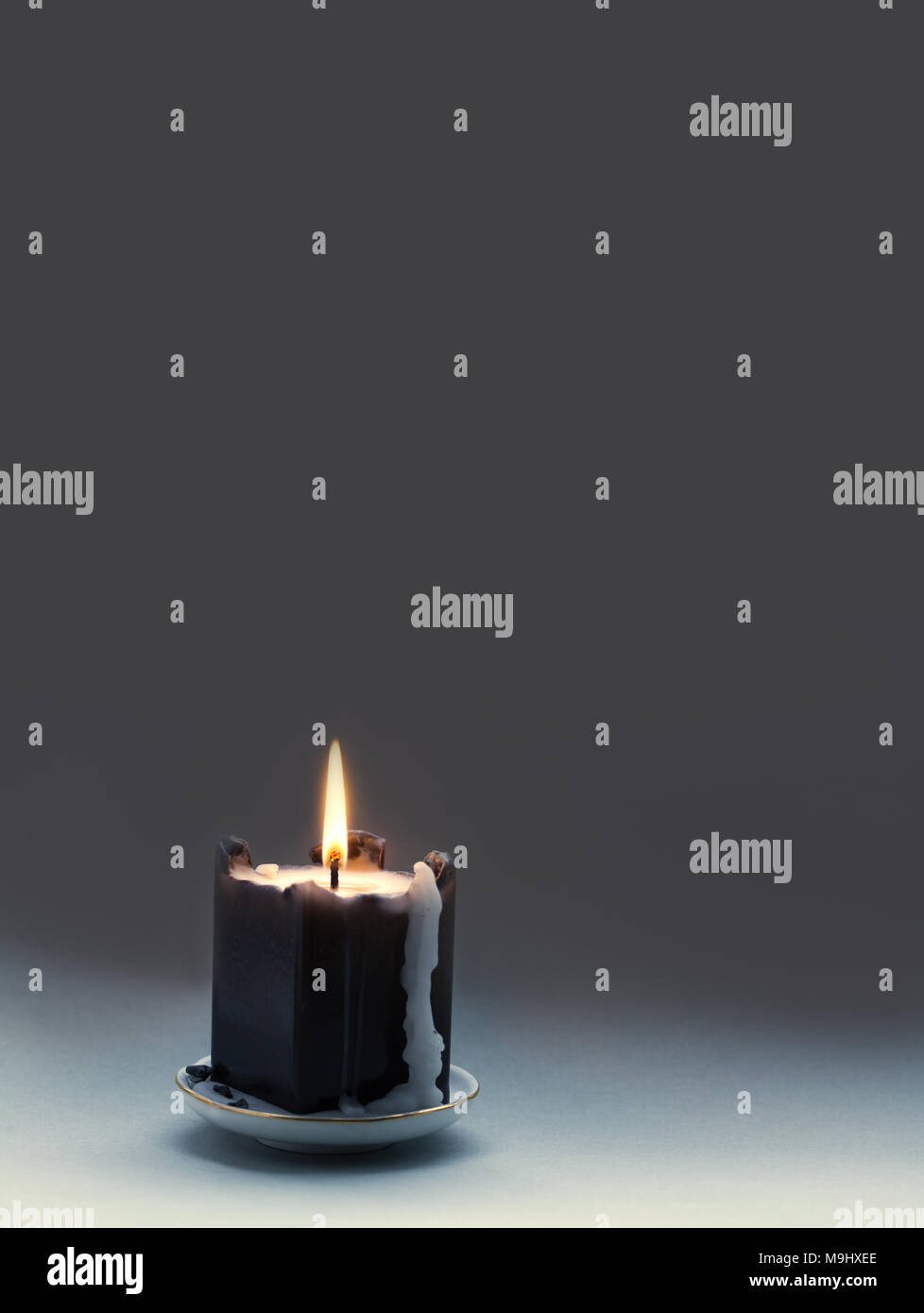 Black Candle With A Flame And Drips Dark Gray Gradient