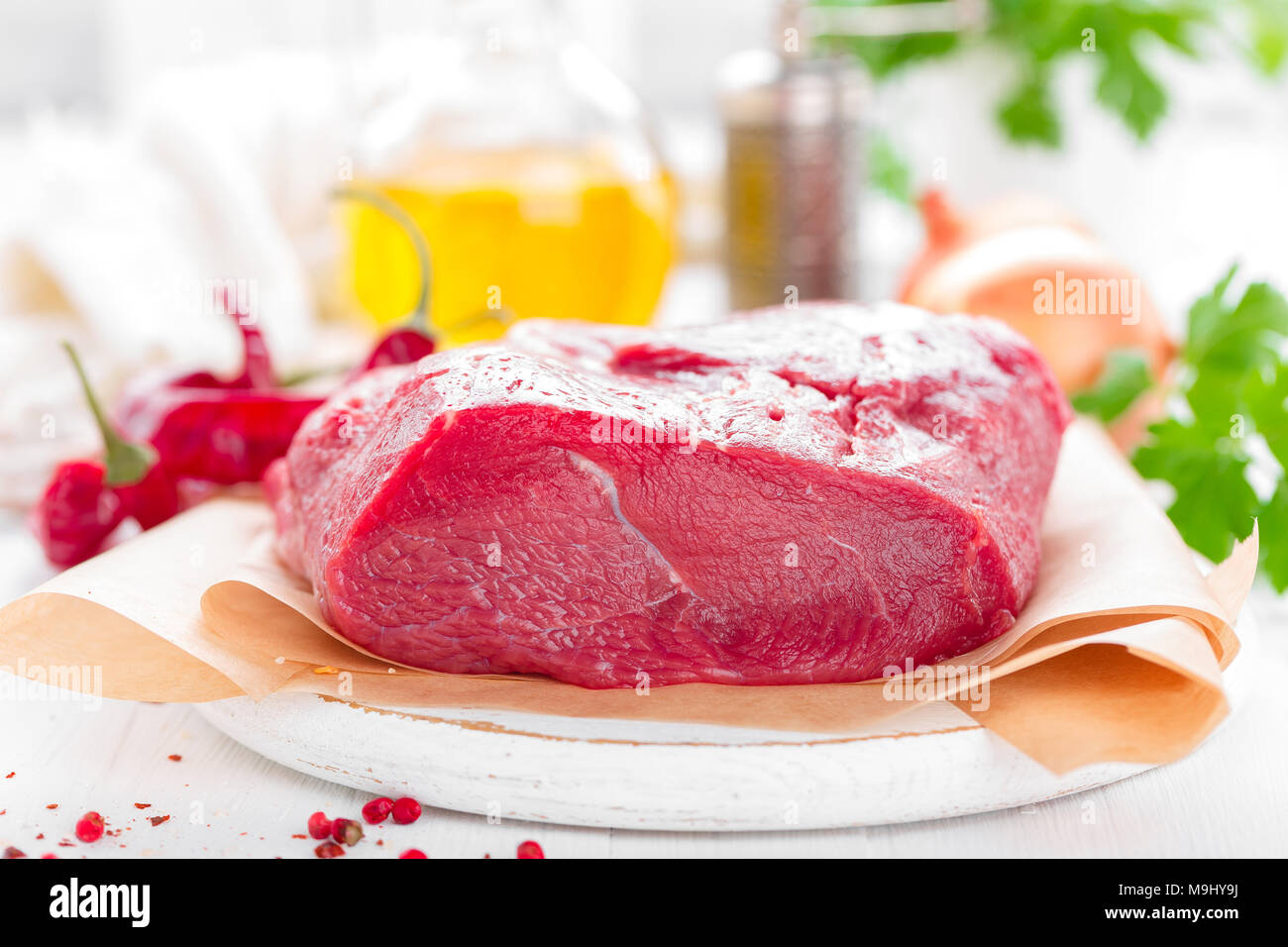 Raw beef meat tenderloin on white background with cooking ingredients ...