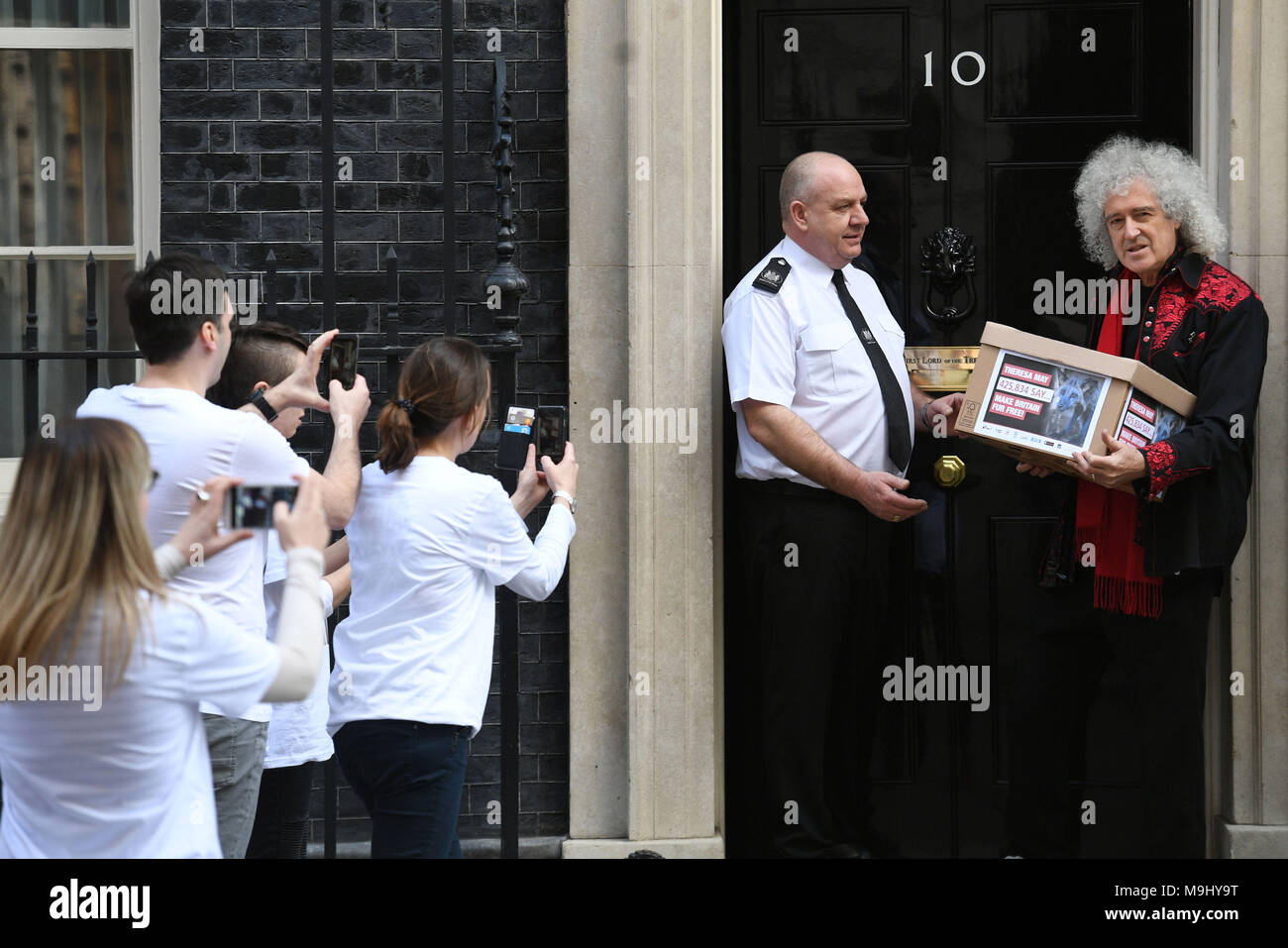 Queen guitarist Brian May and animal protection campaigners at 10 Downing Street in London, to hand in a petition with more than 400,000 signatures urging Prime Minister Theresa May to introduce a UK animal fur import ban. Stock Photo