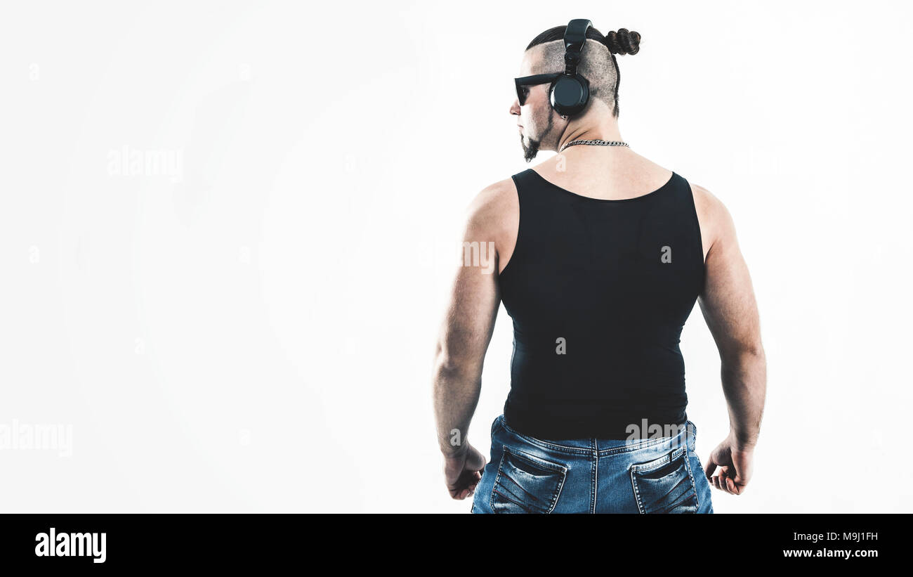 rear view - DJ - rapper with a stylish hairstyle with headphones Stock  Photo - Alamy